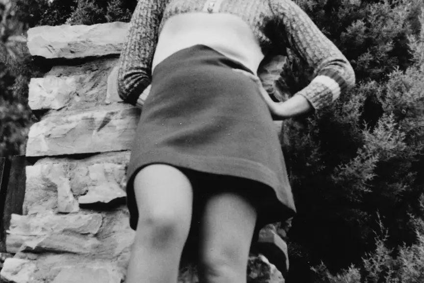 1970s Outdoor portrait of a young woman in the countryside in black and white taken with 35mm film
