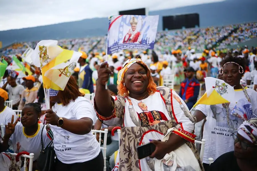 People gather for a holy Mass by Pope Leo XIV at Malabo Stadium, on the last day of his apostolic journey, in Malabo, Equatorial Guinea, April 23, 2026. REUTERS/Guglielmo Mangiapane