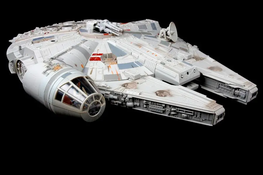 Vancouver, Canada - February 17, 2014: A toy Millenium Falcon, from the Star Wars movie franchise, on a black background. The toy is made by Hasbro