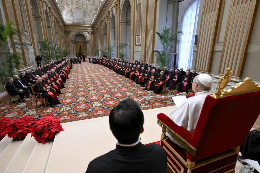 epa12608543 A handout picture provided by the Vatican Media shows Pope Leo XIV (R) during an audience with the members of the Roman Curia in the Vatican City, 22 December 2025. EPA/VATICAN MEDIA HANDOUT HANDOUT EDITORIAL USE ONLY/NO SALES