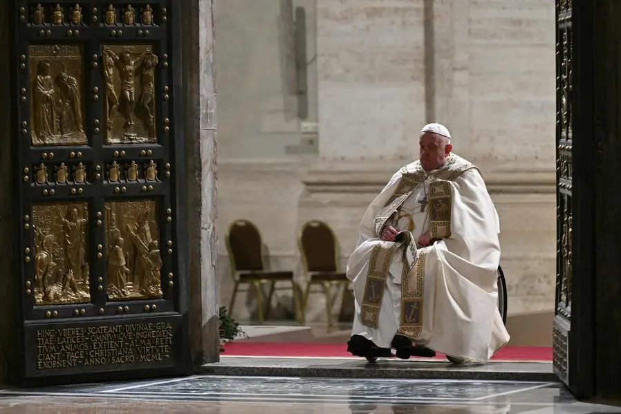 epa11792406 Pope Francis opens the Holy Door of St Peter's Basilica in the Vatican to mark the start of the Catholic Jubilee Year, 24 December 2024. Pope Francis will kick off the 2025 Jubilee of the Catholic Church on Christmas Eve, by opening the 'Holy Door' of St Peter's Basilica. EPA/ALBERTO PIZZOLI / POOL