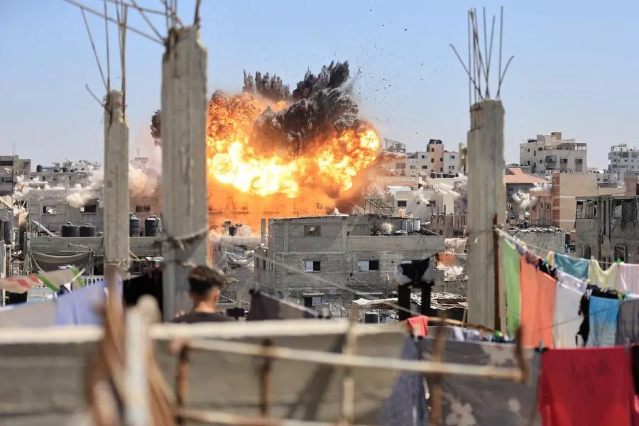 Smoke and flames rise from a house during an Israeli strike, carried out after the Israeli military warned residents to evacuate the area, in Al Shati refugee camp in Gaza City September 9, 2026. REUTERS/ Dawoud Abu Alkas TPX IMAGES OF THE DAY