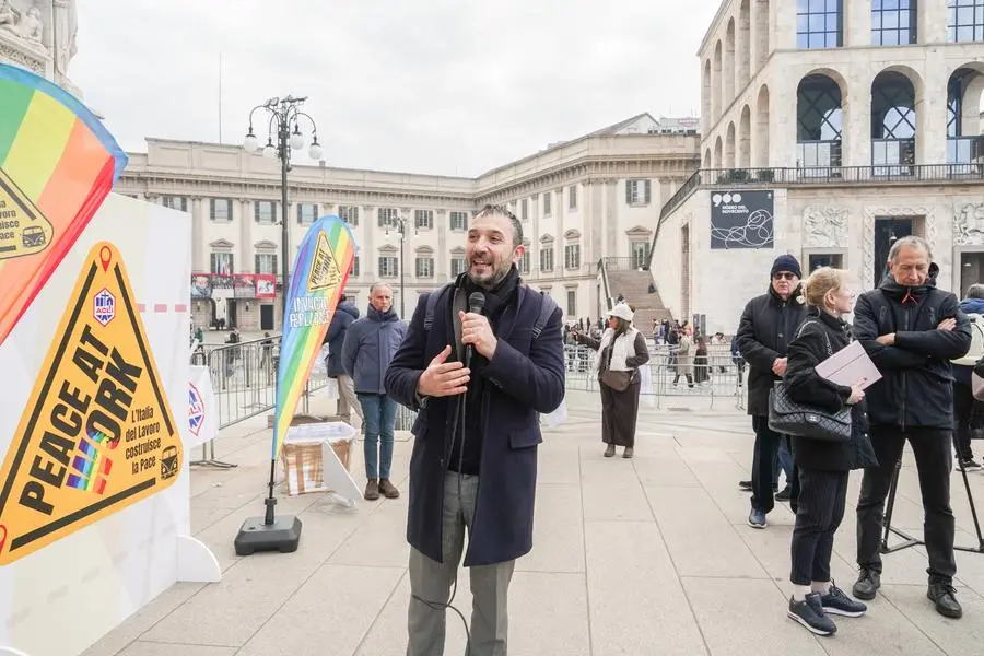 MILAN - The \"Caravan of Peace\" organized by the ACLI, it stops in Milan in the churchyard of the Milan Cathedral. For the occasion, ACLI volunteers unfurled a large peace flag in the cathedral churchyard. In the photo: the president of the national Acli Emiliano Manfredonia. December 10th